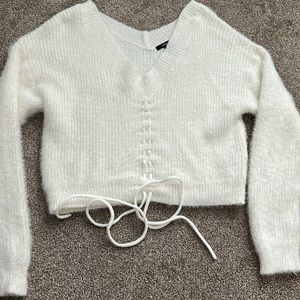 white fuzzy sweater